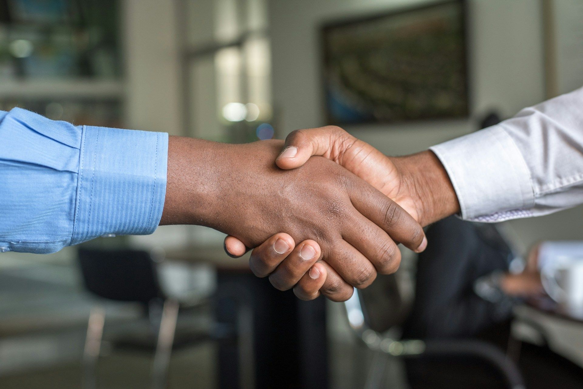 Photo of two people shaking hands